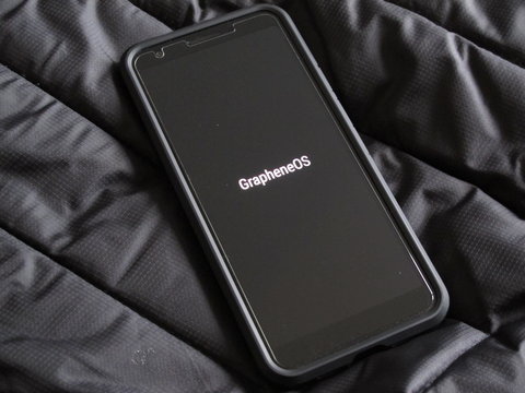 A phone boot screen showing the word 'GrapheneOS'.